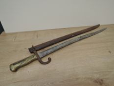 A 1866 French Sword Bayonet for the Chassepot Rifle with metal scabbard, blade length 57cm,