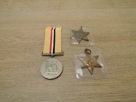 A Queen Elizabeth II Iraq Medal to 25163571 PTE.R.T.P.LOCKHART.SCOTS with ribbon along with two WWII