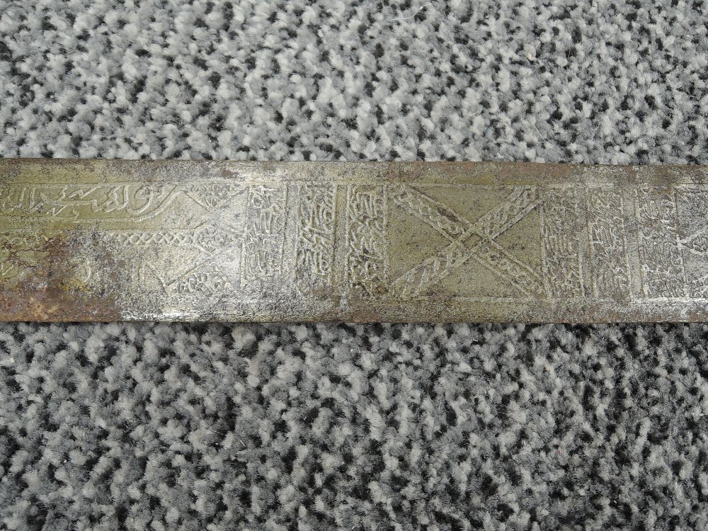 A Sudanese Kaskara Sword having highly decorated blade with Arabic script, wooden grip with - Image 6 of 11