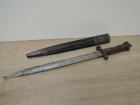 A British Lee Enfield Bayonet MKI with double edged blade, blade marked VR 9 92 Wilkinson, on