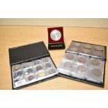 Two small folders of assorted coins, also including a Royal Selangor trophy coin celebrating