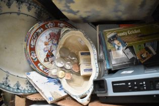 An assorted selection of items including a Polaroid image system E camera, a ceramic tile (AF), an