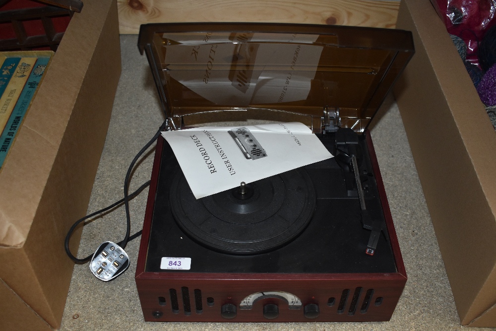 A small portable record deck.