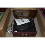 A small portable record deck.