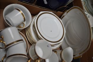 A blended part dinner and tea service in white, having gilt design.