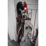 Two vintage golf bags with a small selection of north western justform clubs etc.