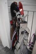 Two vintage golf bags with a small selection of north western justform clubs etc.