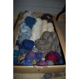 A carton of hand spun wool of assorted thicknesses also includes a small amount of sheep wool.