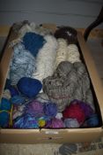 A carton of hand spun wool of assorted thicknesses also includes a small amount of sheep wool.