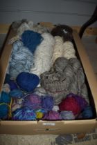 A carton of hand spun wool of assorted thicknesses also includes a small amount of sheep wool.