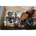 A bronze affect fisherman figure and a selection of assorted cat studies.