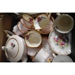 A Royal Imperial part tea service in pink having gilt edging and rose design (21 pieces approx)