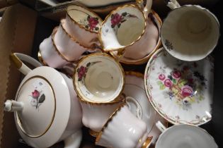 A Royal Imperial part tea service in pink having gilt edging and rose design (21 pieces approx)