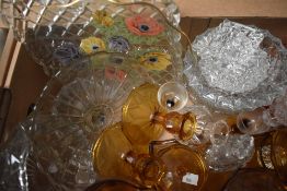 A selection of glass items including pressed glass ash trays, carnival glass bowls and a vintage
