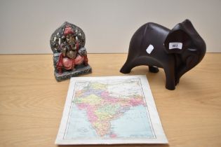 A contemporary resin sculpture of a stylised elephant, measuring 22cm tall, an ethnic and painted