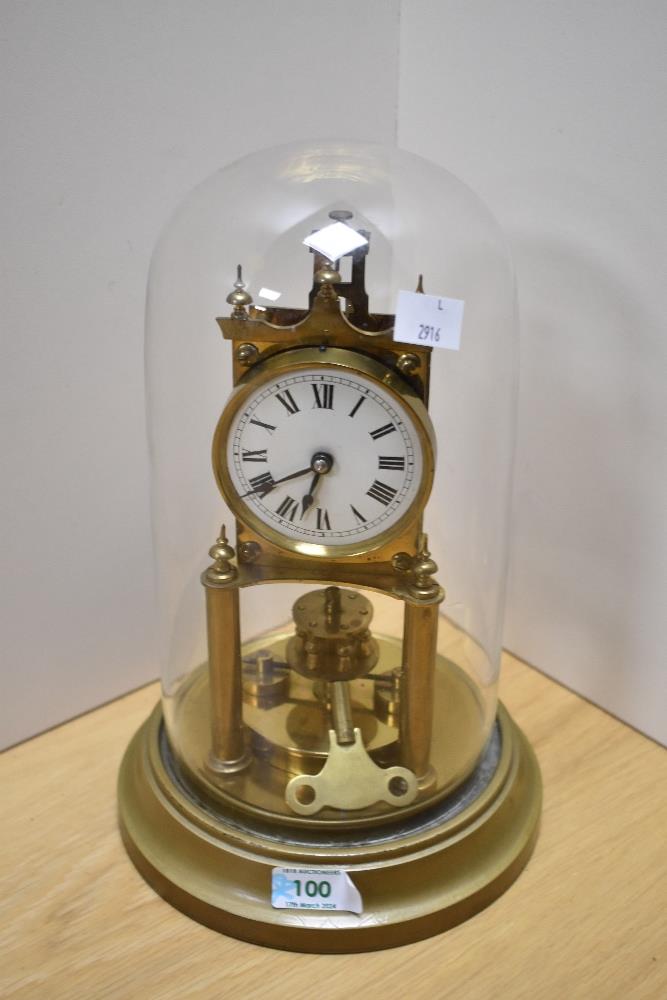 A late 19th/early 20th Century brass anniversary clock, by Gustav Becker, having an enamelled