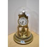 A late 19th/early 20th Century brass anniversary clock, by Gustav Becker, having an enamelled