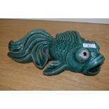 A Chinese green glazed pottery koy fish, measuring 30cm long