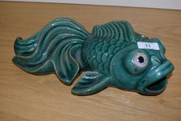 A Chinese green glazed pottery koy fish, measuring 30cm long