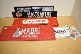A group of various rubber bar/pub drip runners/mats