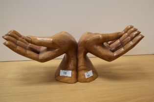 A mid-20th Century carved statuette, cupped hands, measuring 38cm wide