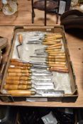 A selection of wooden handled and steel 'bladed' woodworking chisels, mainly marked as Marples but