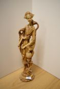 A large cast-resin (to simulate ivory) Oriental figure of a robed female with exotic birds 46cm