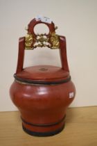 A 19th Century Asian red lacquered bucket or wedding basket, having seal mark to the lid and metal