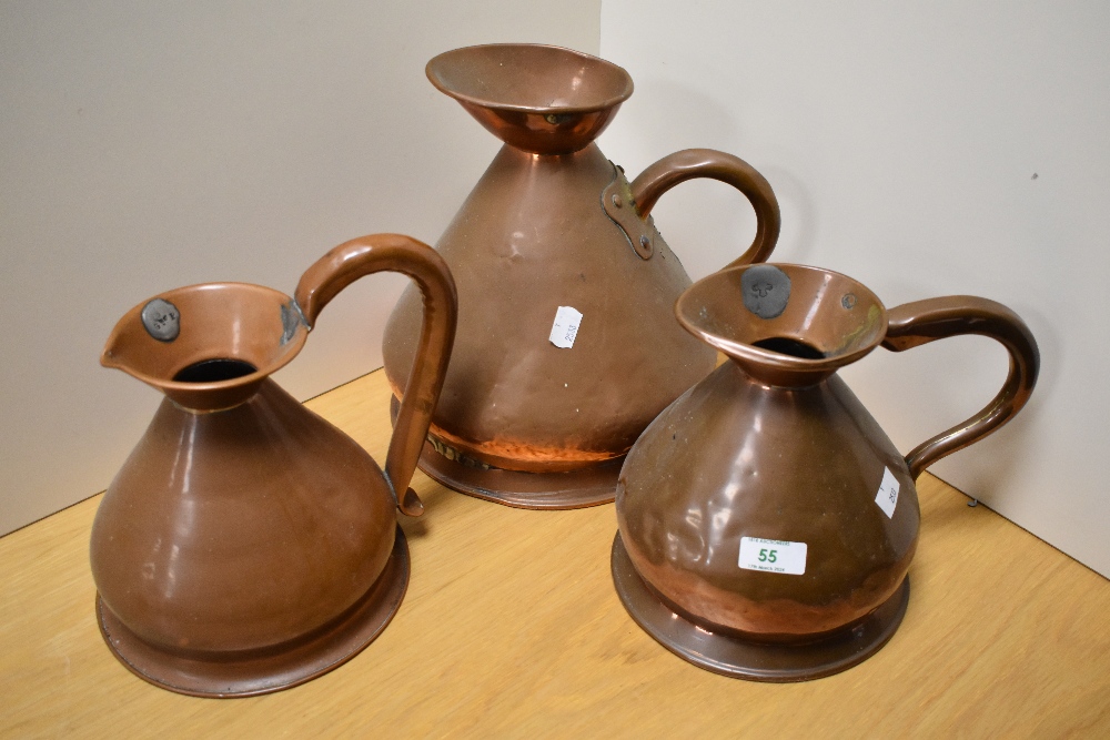 Three 19th Century planished copper measures, of graduating sizes, the largest measures 26cm tall