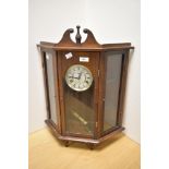 A traditionally styled glass and wood cased 'Reflex' wall clock, having 31 day movement.