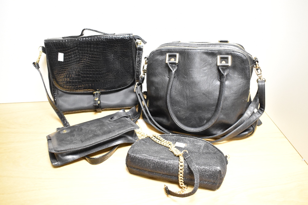 A group of four mixed ladies handbags