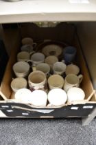 A selection of commemorative china, comprising cups, plates and bowls but including one glass
