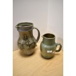 A Sunfield Pottery green mottled glaze jug, of shaped ovoid form with shallow spout to the elongated