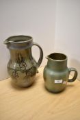 A Sunfield Pottery green mottled glaze jug, of shaped ovoid form with shallow spout to the elongated