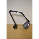 A mid century grey-painted steel industrial machinists angle-poise lamp, with conical shade, and