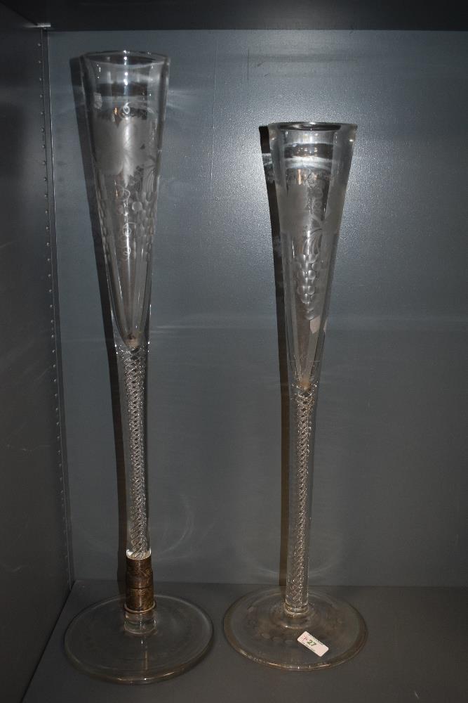 A pair of 19th Century etched glass table centres with air twist stems, the largest measures 72cm