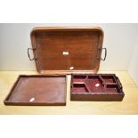 An Edwardian oak two-handled tray, of rounded rectangular form with applied coppered handles, 50cm