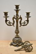 A Victorian brass three branch candelabra, measuring 40cm tall, and an ornamental brass cannon