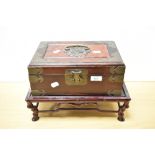 A Chinese brass-mounted and plush lined and fitted jewellery box with carrying handles to each side,