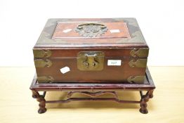 A Chinese brass-mounted and plush lined and fitted jewellery box with carrying handles to each side,