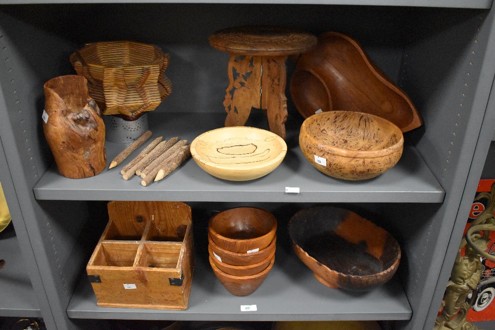 A selection of turned and carved wooden bowls and stands, to include carved eastern table/stand