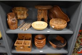 A selection of turned and carved wooden bowls and stands, to include carved eastern table/stand