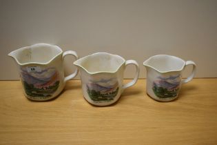A trio of Nelson ware pitcher jugs, of Lake District interest, and decorated with a scene