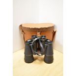 A pair of Zenith No70675 10x50 field binoculars, together with stitched tan leather case