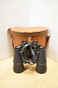 A pair of Zenith No70675 10x50 field binoculars, together with stitched tan leather case