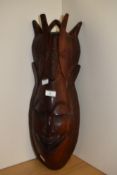 A large African carved hardwood tribal mask, measuring 66cm tall