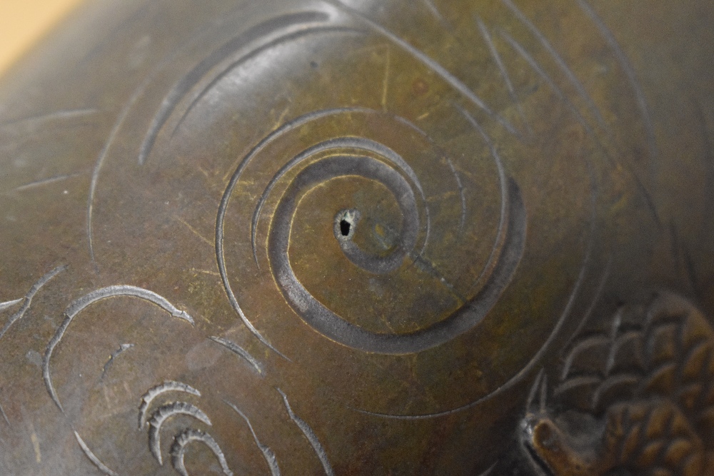 A 19th Century Chinese bronze metal vase, decorated in relief with a dragon, raised on a hardwood - Image 2 of 5