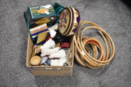 A collection of needlepoint embroidery and crafting materials, frames, threads, tassles, edging etc
