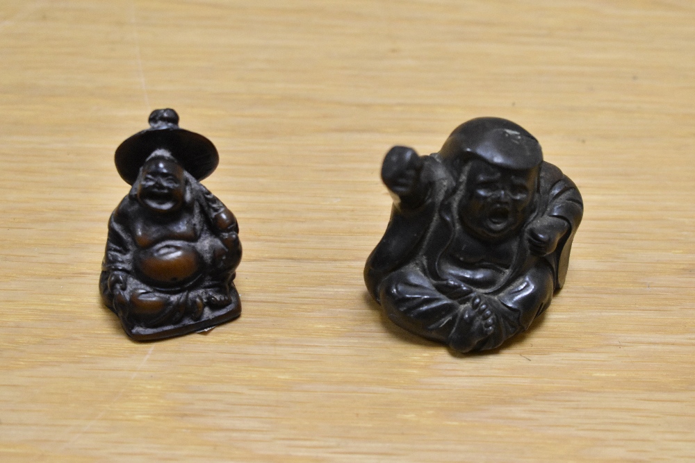 Two Chinese cast resin Buddha figures, the largest measures 5cm tall