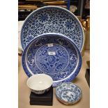 A large Chinese blue and white pottery charger, of dishes circular form decorated with stylised